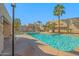 A sparkling community pool offers residents a refreshing oasis, surrounded by palm trees and comfortable lounge chairs at 11333 N 92Nd St # 2072, Scottsdale, AZ 85260
