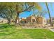 Exterior view of the Mission de los Arroyos community featuring mature trees and desert landscaping at 11333 N 92Nd St # 2072, Scottsdale, AZ 85260