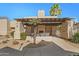 Exterior lounge area featuring stucco walls, fireplace, seating, pergola, mature landscaping and walkway at 11333 N 92Nd St # 2072, Scottsdale, AZ 85260