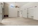 Spacious living room with a fireplace, carpeted floor, built-in shelves and a window at 11333 N 92Nd St # 2072, Scottsdale, AZ 85260