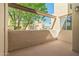 Cozy balcony with covered beams and a view of the surrounding apartment buildings at 11333 N 92Nd St # 2072, Scottsdale, AZ 85260