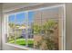 Bright window view overlooking green lawn, trees, and neighboring apartments at 11333 N 92Nd St # 2072, Scottsdale, AZ 85260