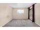 Inviting bedroom featuring a sliding glass door, soft carpet, and plenty of natural light at 1317 E Cobb Dr, Tempe, AZ 85288