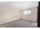 Neutral bedroom with a large window and plush carpeting provides a calming retreat at 1317 E Cobb Dr, Tempe, AZ 85288