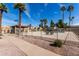 Community pool area with lounge chairs, surrounded by desert landscaping and a secure fence at 1317 E Cobb Dr, Tempe, AZ 85288