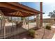 Enclosed community pool area showcasing covered seating, greenery, and palm trees in the background at 1317 E Cobb Dr, Tempe, AZ 85288
