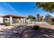 Gated community pool area with a ramada and seating surrounded by lush landscaping at 1317 E Cobb Dr, Tempe, AZ 85288