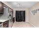 Galley kitchen featuring stainless steel appliances, granite counters, and brown cabinets at 1317 E Cobb Dr, Tempe, AZ 85288