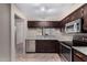 Bright kitchen featuring stainless steel appliances, granite countertops, and abundant cabinet space at 1317 E Cobb Dr, Tempe, AZ 85288