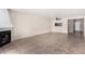 A large living room features tile flooring, a fireplace, and an open floor plan with a ceiling fan at 1317 E Cobb Dr, Tempe, AZ 85288