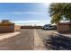 Exterior view of a parking lot with assigned parking spaces, desert landscaping, and easy access to the community at 1317 E Cobb Dr, Tempe, AZ 85288