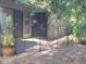 View of the outdoor patio area with a black decorative fence, accessible through sliding glass doors at 1317 E Cobb Dr, Tempe, AZ 85288