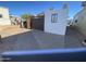 Home featuring a paved walkway and a partially enclosed patio, perfect for outdoor living at 1344 W Inuit Ave, Apache Junction, AZ 85119