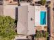 Birds eye view of the roof and blue backyard pool and fence at 1649 E Dana Ave, Mesa, AZ 85204