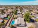 Neighborhood aerial view, complete with a sparkling pool at 1649 E Dana Ave, Mesa, AZ 85204