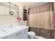 Bathroom featuring a single sink, mirror, and a shower with a striped curtain at 1649 E Dana Ave, Mesa, AZ 85204