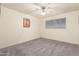 Bedroom featuring a window, ceiling fan, carpet flooring, and neutral-colored walls at 1649 E Dana Ave, Mesa, AZ 85204
