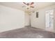 Bedroom with a ceiling fan, carpet flooring, and neutral-colored walls at 1649 E Dana Ave, Mesa, AZ 85204