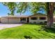 Charming single-story home with a well-manicured lawn and mature trees, set in a desirable neighborhood at 1649 E Dana Ave, Mesa, AZ 85204