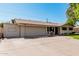 One-story home with an attached garage and wide driveway at 1649 E Dana Ave, Mesa, AZ 85204