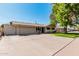 A nice view of single-story home with an attached garage at 1649 E Dana Ave, Mesa, AZ 85204