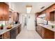Efficient kitchen features stainless appliances, ample counter space, and custom cabinetry, perfect for culinary enthusiasts at 1649 E Dana Ave, Mesa, AZ 85204