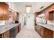 Well-lit kitchen with updated appliances, tile flooring, and plenty of cabinet storage at 1649 E Dana Ave, Mesa, AZ 85204