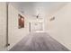 Spacious living room with new carpet, neutral walls, ceiling fan, and good lighting at 1649 E Dana Ave, Mesa, AZ 85204