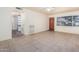 Bright living room with neutral walls, ceiling fan, and tile flooring offers a welcoming space at 1649 E Dana Ave, Mesa, AZ 85204