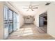 Bright living room showcasing wood-look flooring, ceiling fans, and easy access to the kitchen at 1649 E Dana Ave, Mesa, AZ 85204