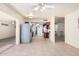Inviting living room with tile floors, ceiling fans, and an open layout leading into the kitchen at 1649 E Dana Ave, Mesa, AZ 85204