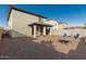Gravel backyard with block wall fence and covered patio at 17339 W Paraiso Ln, Surprise, AZ 85387