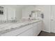 Double vanity bathroom featuring granite countertops and modern fixtures at 17339 W Paraiso Ln, Surprise, AZ 85387