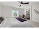 Inviting bedroom with a ceiling fan, a chair, and a neutral color palette at 17339 W Paraiso Ln, Surprise, AZ 85387