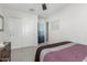 Bright bedroom features a ceiling fan, closet, and neutral decor at 17339 W Paraiso Ln, Surprise, AZ 85387