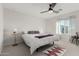 Serene bedroom with a ceiling fan and plenty of natural light from a bright window at 17339 W Paraiso Ln, Surprise, AZ 85387
