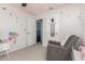 Cozy bedroom featuring butterfly decals and comfortable gray rocking chair at 17339 W Paraiso Ln, Surprise, AZ 85387