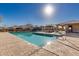 Sparkling community pool with clear water and ample lounge space at 17339 W Paraiso Ln, Surprise, AZ 85387