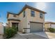 Two-story home with a two-car garage, neutral stucco exterior, and minimal landscaping at 17339 W Paraiso Ln, Surprise, AZ 85387