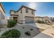 Charming home with a two car garage, desert landscaping, and a well-maintained yard in a Gathering-friendly neighborhood at 17339 W Paraiso Ln, Surprise, AZ 85387