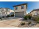 Well maintained two-story house with a two-car garage and modern exterior in a suburban setting at 17339 W Paraiso Ln, Surprise, AZ 85387