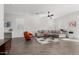 Spacious living room with stylish furniture, wood-look flooring, and neutral decor at 17339 W Paraiso Ln, Surprise, AZ 85387