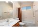 Bathroom features a vanity, toilet, combination shower and tub, and a mirror at 18123 W Hayden Dr, Surprise, AZ 85374