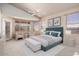 Bedroom featuring neutral tones, carpet floors, fan, and natural light from multiple windows at 18123 W Hayden Dr, Surprise, AZ 85374