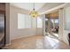 Breakfast nook with a sliding glass door offering outdoor views and natural light at 18123 W Hayden Dr, Surprise, AZ 85374