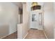 Welcoming foyer with tile flooring, high ceilings, and an ornate light fixture at 18123 W Hayden Dr, Surprise, AZ 85374