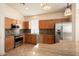 This kitchen features stainless steel appliances, granite countertops, and light brown cabinets at 18123 W Hayden Dr, Surprise, AZ 85374