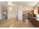 Bright kitchen features granite countertops, stainless steel appliances, and ample cabinet space at 18123 W Hayden Dr, Surprise, AZ 85374