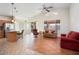 The living room has an open floor plan with tile flooring and large windows at 18123 W Hayden Dr, Surprise, AZ 85374