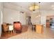 Spacious living area showcasing tile flooring, and an adjacent kitchen bar at 18123 W Hayden Dr, Surprise, AZ 85374